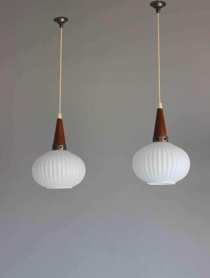 Pair of French etched ribbed glass over counter pendants
