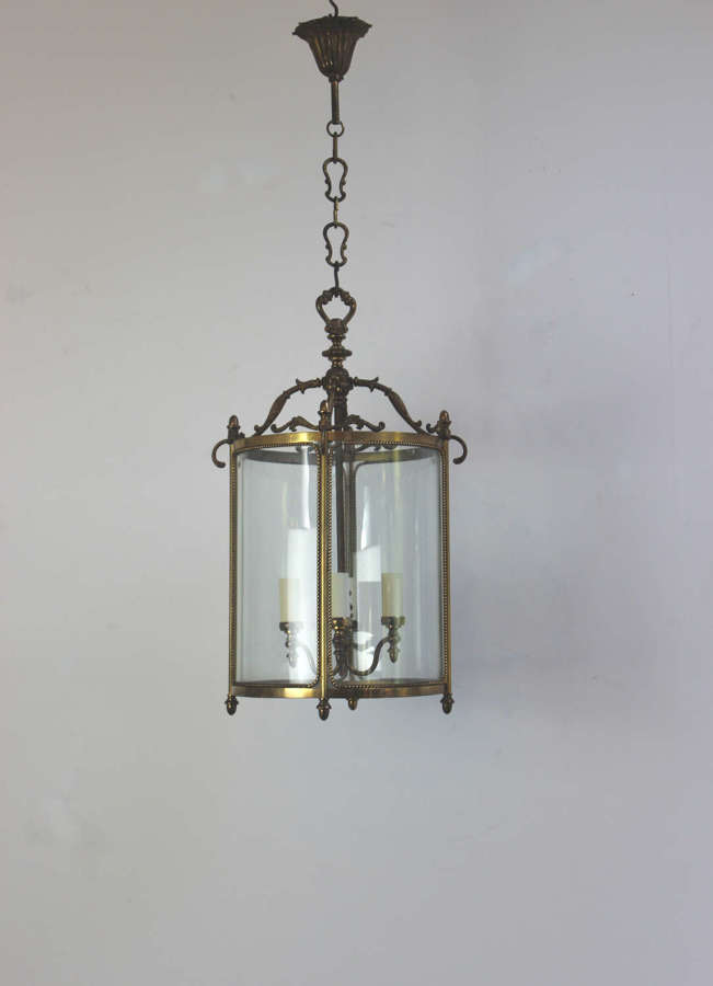 Elegant circular glass and brass framed entrance hall lantern