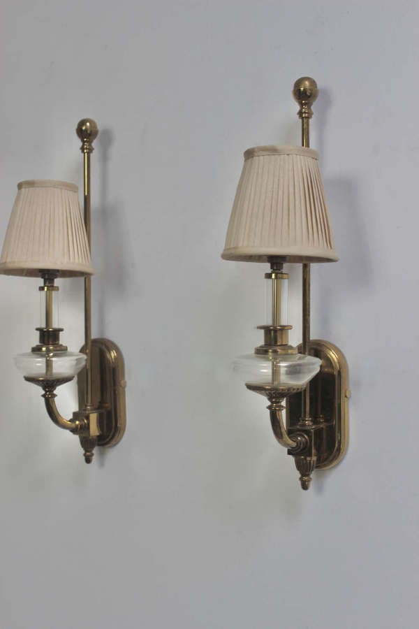 Pair of brass and glass storm lanterns with custom pleated shades
